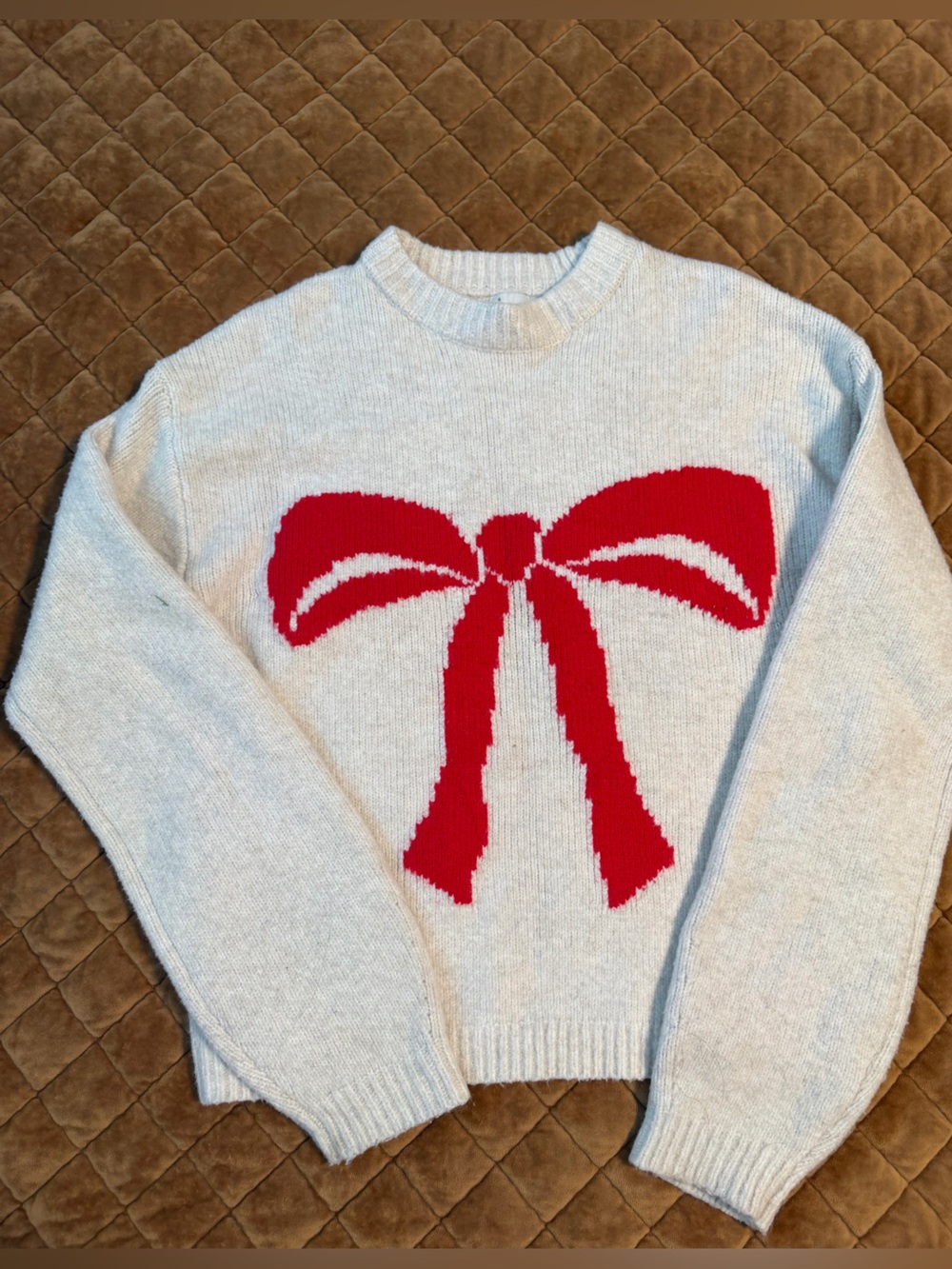 a new day Cream Crewneck Sweater with Red Bow Graphic
